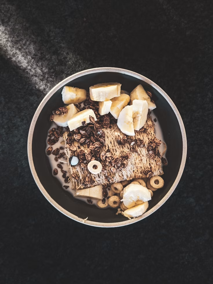 high protein overnight oats bowl with banana and berries